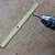 12. Отрезал от листа латуни полоску толщиной 0,8 мм. Просверлил отверстие диаметром 2,5 мм.
